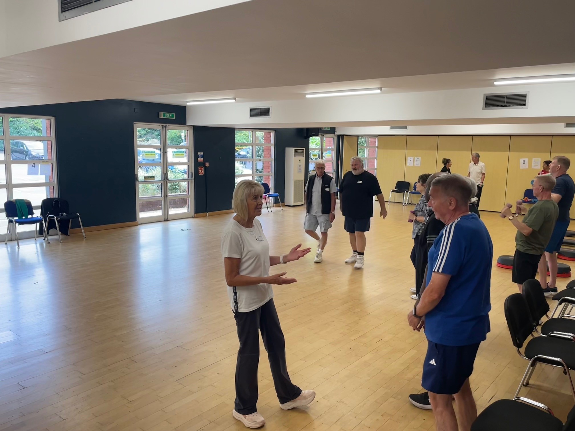 Community wellbeing discussion taking place between a Mytime Active trustee and members.