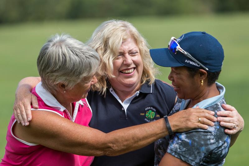 Three ladies enjoying playing golf