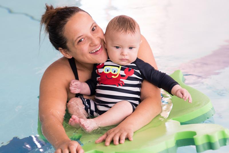 Mother and baby swimming