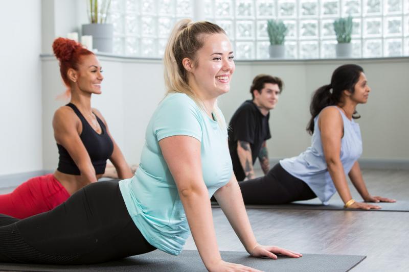 People in a yoga class starting their wellbeing journey