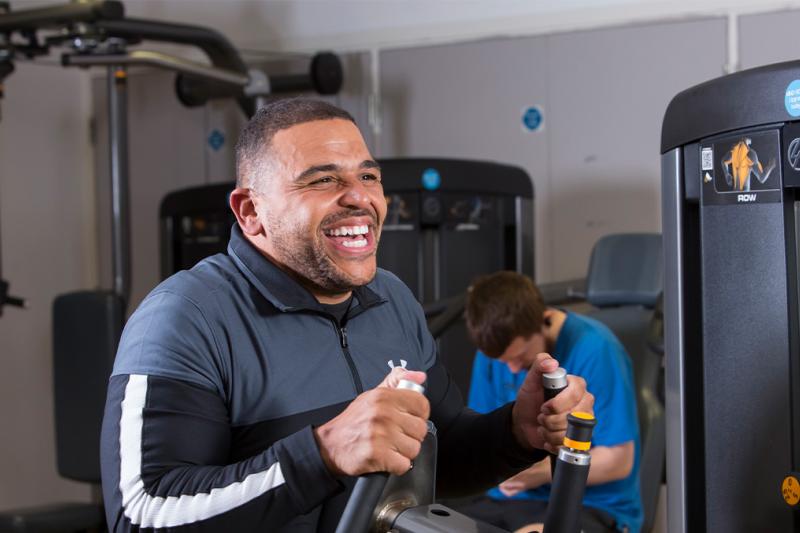 Darren smiling in the gym