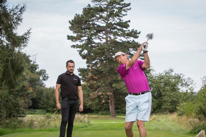 Man having a golf lesson