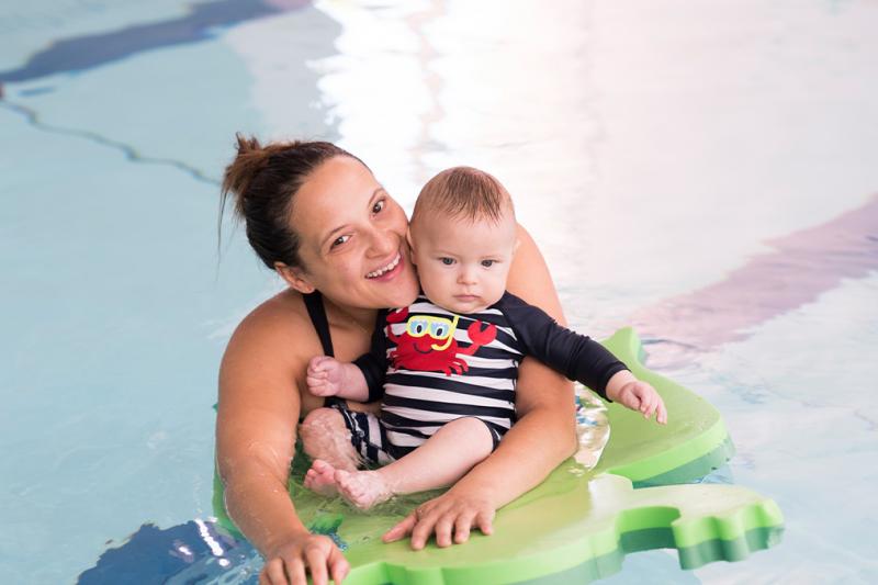 Mother and baby swimming